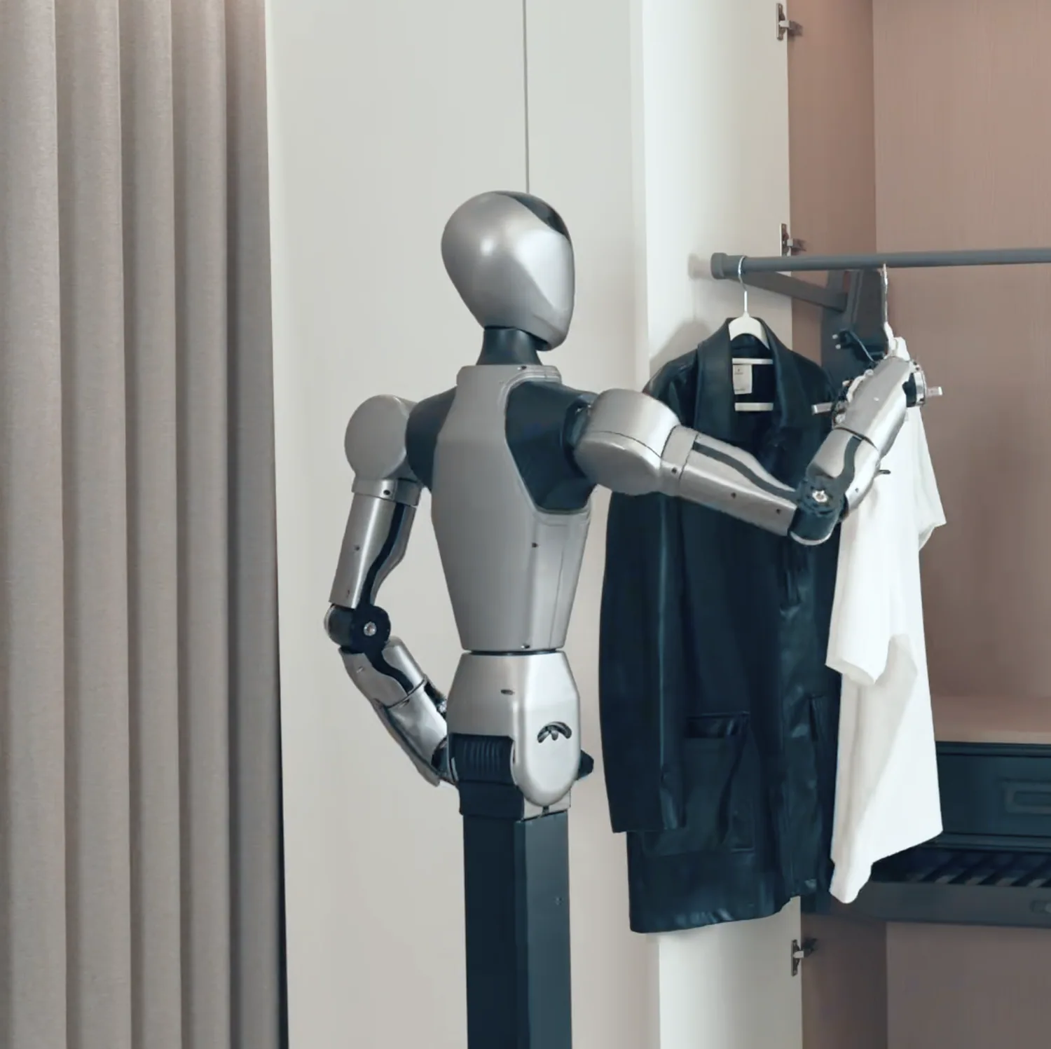 HUMANOID ROBOT assisting with clothing at a wardrobe.